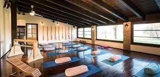 Yoga room with mats, props and a rope wall at La Locanda della Quercia Calante